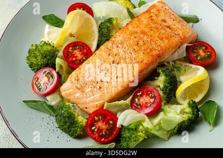 grilled salmon fillet, with vegetables, broccoli, cherry, iceberg lettuce, spices and herbs, homemade, no people, Stock Photo