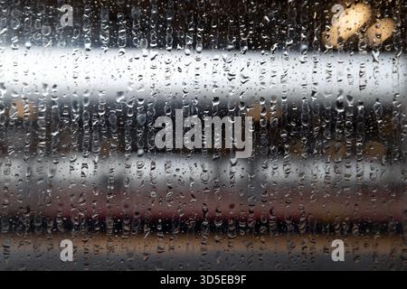 Train Station View Through Rain Covered Window Stock Photo