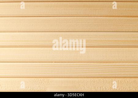 Horizontal pattern of pure natural wood slats in warm color as a full-screen solid background Stock Photo
