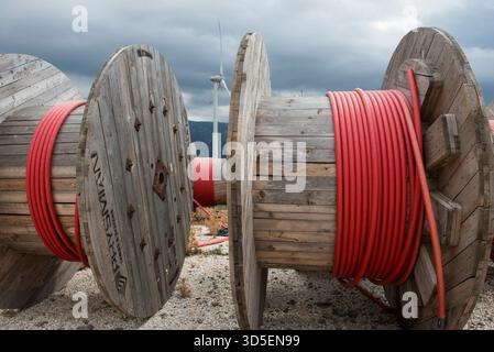 TURKEY, Karaburun near Izmir, 223 MW wind farm  of company Lodos Elektrik with Enercon E-82 wind turbines, copper cable reel of italian company Prysmian / TUERKEI, Karaburun, 223 MW Windpark der Firma Lodos Elektrik mit Enercon E-82 Windkraftanlagen, Kupfer Kabeltrommel des italienischen Kabelhersteller Prysmian S.p.A. the world leader in cable manufacturer Stock Photo