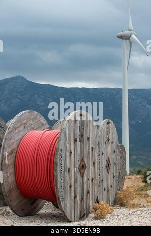 TURKEY, Karaburun near Izmir, 223 MW wind farm  of company Lodos Elektrik with Enercon E-82 wind turbines, copper cable reel of italian company Prysmian / TUERKEI, Karaburun, 223 MW Windpark der Firma Lodos Elektrik mit Enercon E-82 Windkraftanlagen, Kupfer Kabeltrommel des italienischen Kabelhersteller Prysmian S.p.A. the world leader in cable manufacturer Stock Photo