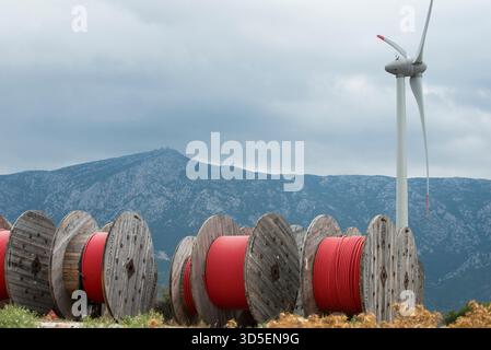 TURKEY, Karaburun near Izmir, 223 MW wind farm  of company Lodos Elektrik with Enercon E-82 wind turbines, copper cable reel of italian company Prysmian / TUERKEI, Karaburun, 223 MW Windpark der Firma Lodos Elektrik mit Enercon E-82 Windkraftanlagen, Kupfer Kabeltrommel des italienischen Kabelhersteller Prysmian S.p.A. the world leader in cable manufacturer Stock Photo
