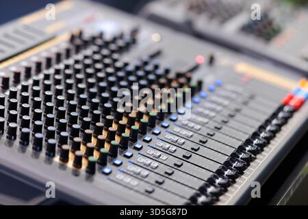 Live sound mixing desk close up. Selective focus. Stock Photo