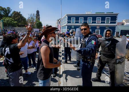 Police officer and a protester clash during the overnight clearance of ...
