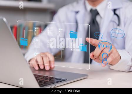 Medical doctor using laptop, exploring virtual EHR and AI for help. Digital transformation in healthcare, smart hospital. Efficient data management, p Stock Photo