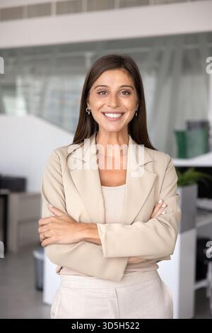 Happy confident beautiful young Latin businesswoman standing for portrait Stock Photo