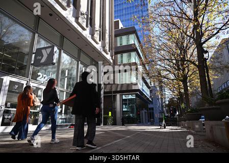 Three women walking down the sidewalk on Fayetteville Street in Raleigh, North Carolina. Stock Photo