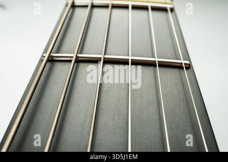 High-resolution image of a classic acoustic guitar, showcasing quality and elegance Focus is sharp enough to almost hear the strumming echo Suitable f Stock Photo
