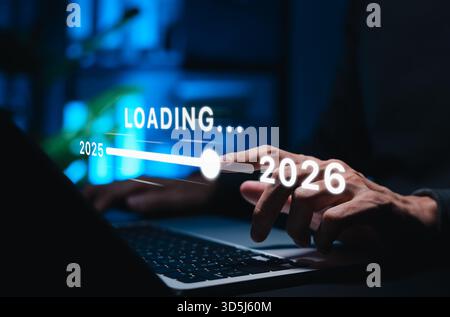 New year transition and future planning concept. Person interacting with progress bar loading from 2025 to 2026, symbolizing innovation, trends, Stock Photo