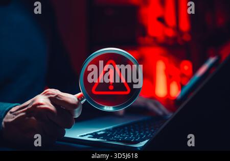 Cyber threat detection and data risk warning concept. Person holding magnifying glass with digital alert symbol representing cybersecurity breach, Stock Photo