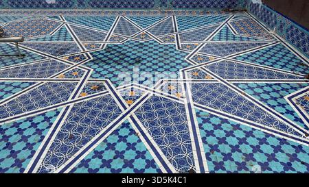 Decorative geometric mosaic pattern featuring shades of blue and white, suitable for background use. Mobile photo Stock Photo