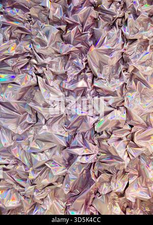 Crinkled holographic foil texture with iridescent colors creating abstract shiny background. Mobile photo Stock Photo