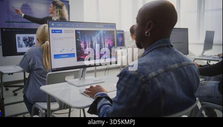 Focused Man Creating Futuristic City Image With AI Software in Modern Classroom. African American Man Using AI Software to Generate Image. Concept of Digital Transformation Through AI in Education. Stock Photo