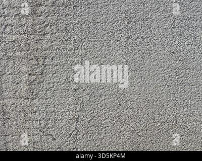 Monolithic wall background. Horizontal light gray grunge texture with copy space. Gray concrete texture. Stock Photo