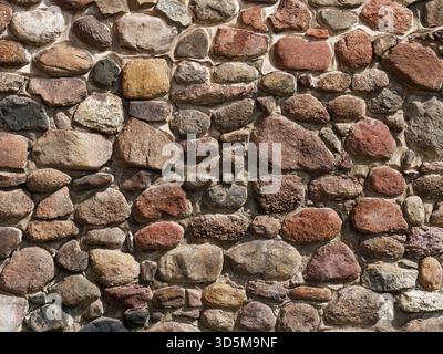 Wall made from concrete and stones, can be used as a background Stock Photo