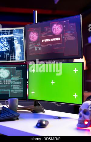 Hacking code scripts running on green screen mockup computer attacking firewalls. Programming language malware software shown on chroma key PC used by cyber criminals to breach security Stock Photo