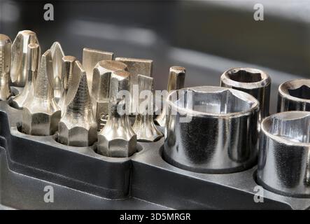 Drill screwdriver bits socket set network tool repair kit metal fastener mechanical components. Stock Photo