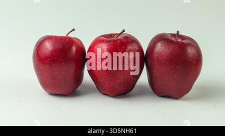 four red apples on a white background Stock Photo