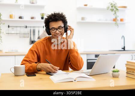 Young Man Studying at Home Stock Photo