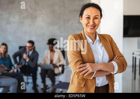Professional in office environment, highlighting teamwork, collaboration, leadership, and innovation Stock Photo