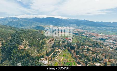 Drone flying aerial view Granada Spain beautiful Alhambra palace with Generalife gardens UNESCO World Heritage travel scenic landscape horizon sky Stock Photo