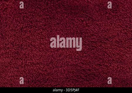 Deep red burgundy sherpa fleece fabric background Stock Photo