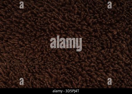 Fluffy dark brown sherpa fleece fabric background Stock Photo