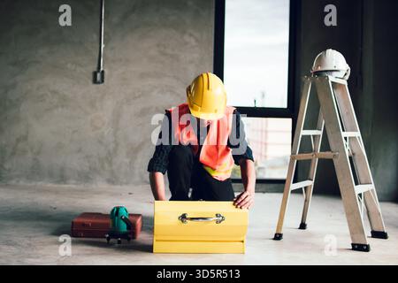 Male worker with tools box, engineer worker prepare tools Stock Photo