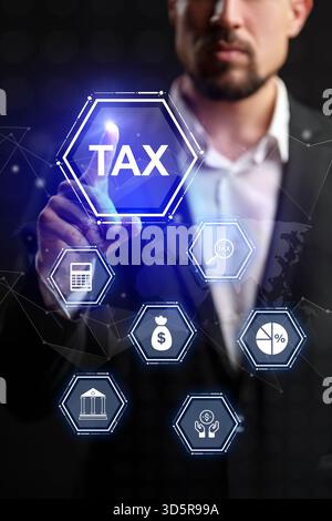 Professional man interacting with tax-related digital icons in a modern office setting Stock Photo
