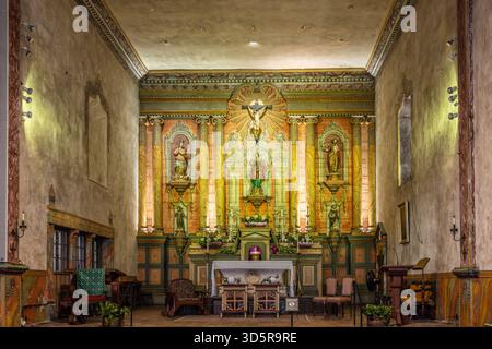 Full view of the ornate altar and sanctuary interior of Mission Santa Barbara in California. Stock Photo