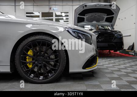 Mercedes Benz AMG coupe detail in premium automotive workshop Stock Photo