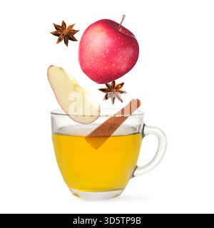Health boosting drink for cold season. Apples, cinnamon and anise falling into cup on white background Stock Photo