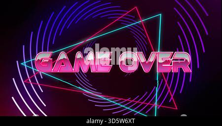 Displaying central neon GAME OVER text glowing on synthwave title card, with cyan magenta triangles Stock Photo