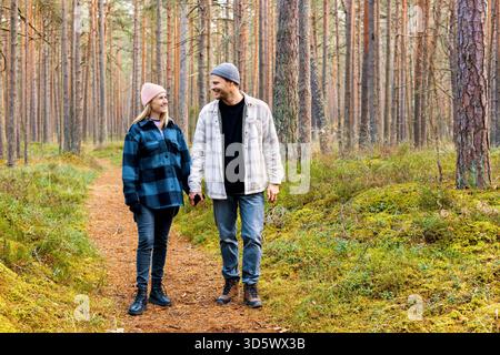 smiling couple on romantic autumn park walk Stock Photo