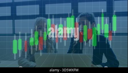 Analyzing three colleagues in blazers examining candlestick chart in office with laptop on table Stock Photo