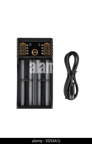 Black two-slot rechargeable battery charger with LCD display and USB charging cable, isolated white. Stock Photo