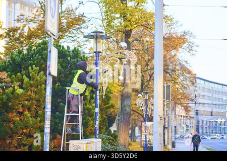 NO MODEL RELEASE AVAILABLE, can only be used for editorial and news, city workers put Christmas street lights on public street lamps in preparation fo Stock Photo