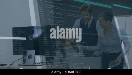 Leaning coworkers in shirts, vest pointing and reviewing with code overlay at office, with laptop Stock Photo
