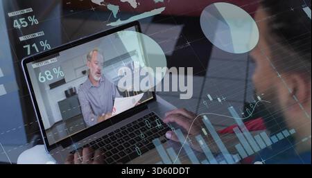 Watching laptop screen presenter wearing shirt speaking in kitchen, holding printed papers, charts Stock Photo