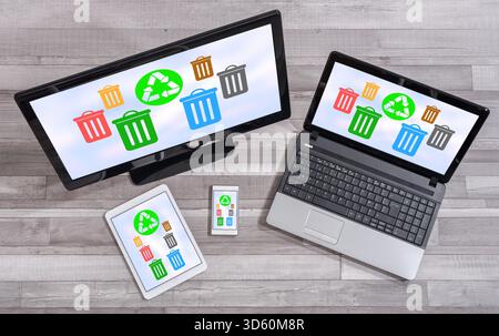 Recycling concept shown on different information technology devices Stock Photo