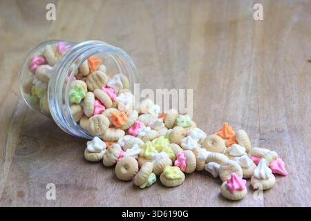 Gem rose is a small, round cake or biscuit topped with a layer of dry sugar in various colors. Stock Photo