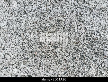 grainy cement floor with small dark stones. construction background. high resolution. Stock Photo