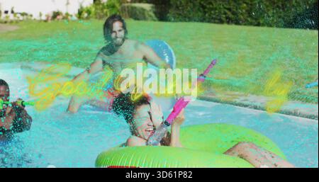 Aiming woman squirting pink water gun in home pool, seated in bright green donut wearing swimsuit Stock Photo