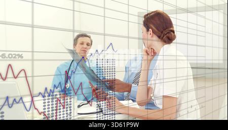 Reviewing medical trio discussing patient metrics in clinic, wearing scrubs, coat, tie with charts Stock Photo