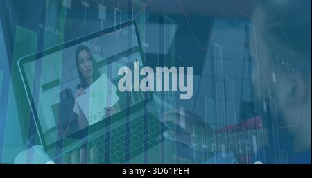 Typing hands at desk on laptop while presenter in dark blazer holding printed charts, overlays Stock Photo