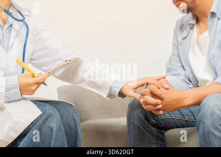 Empathy, trust and doctor holding hands with patient for help, consulting support and healthcare advice. Cropped shot and side view. Stock Photo