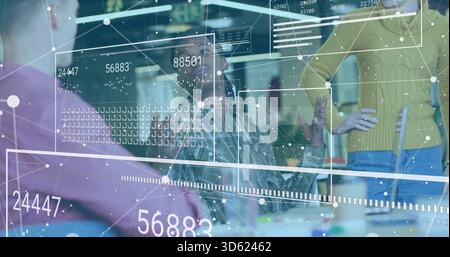 Gesturing analyst and team wearing purple top and yellow sweater viewing AR data overlay at table Stock Photo