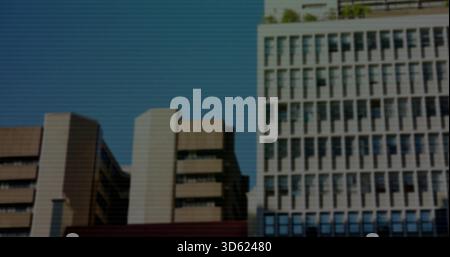 Showing midrise buildings lining left city street, with recessed windows and grid tower, copy space Stock Photo