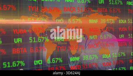 Analyzing man in business suit studying market data in trading office with tickers, copy space Stock Photo