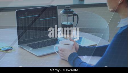 Working woman in blue top holding mug, typing code on laptop at home desk, copy space Stock Photo